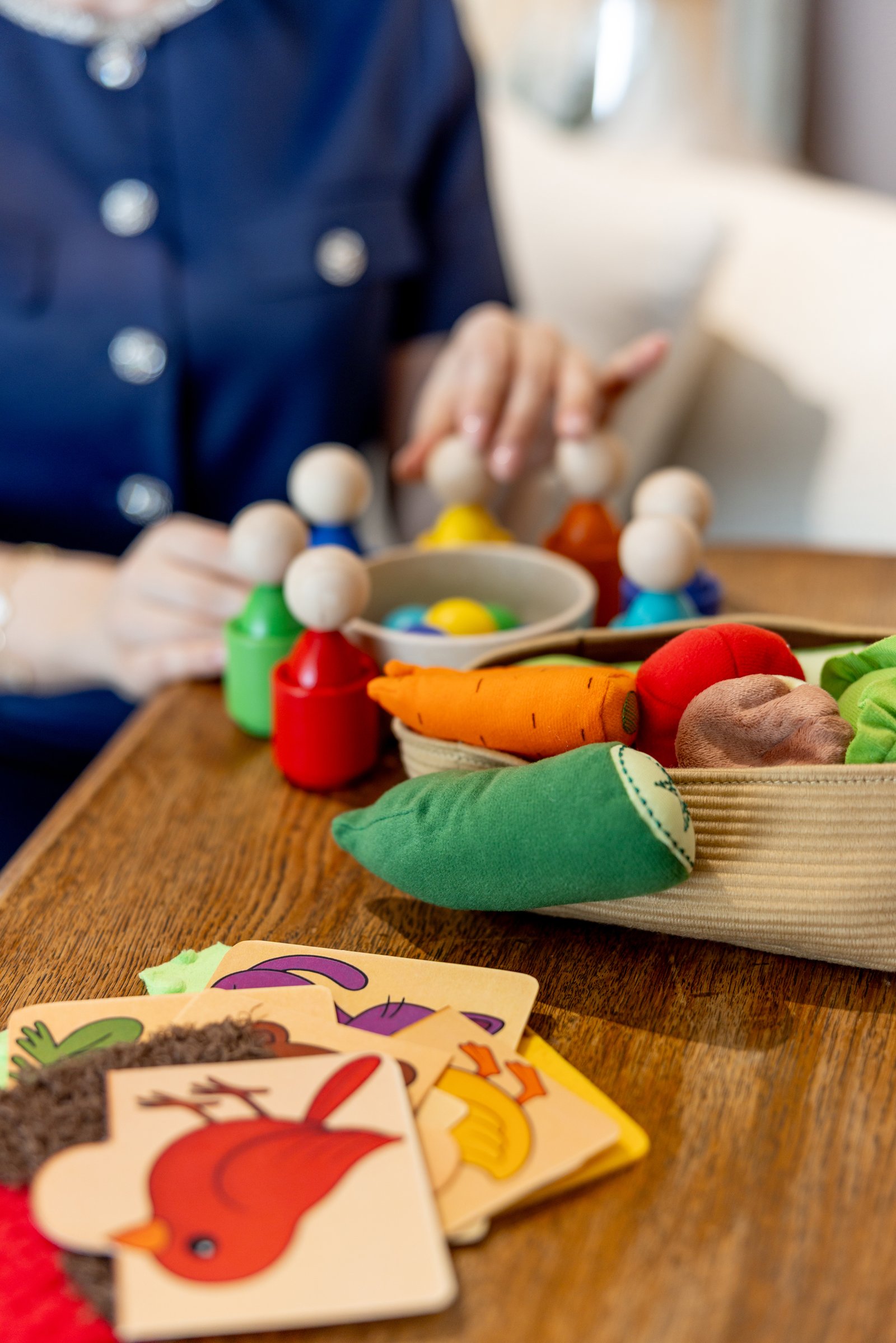 Primary school child reading English book with teacher guidance in Dubai
